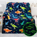 Jekeno Dinosaur Glow in The Dark Blanket Dino Gift Throw for Kids Boys Girls Birthday Christmas Halloween Easter Decor for Age 1-16 Years Old Teens Child Toddler Son Throw Navy Blue 60"x80" by Jekeno